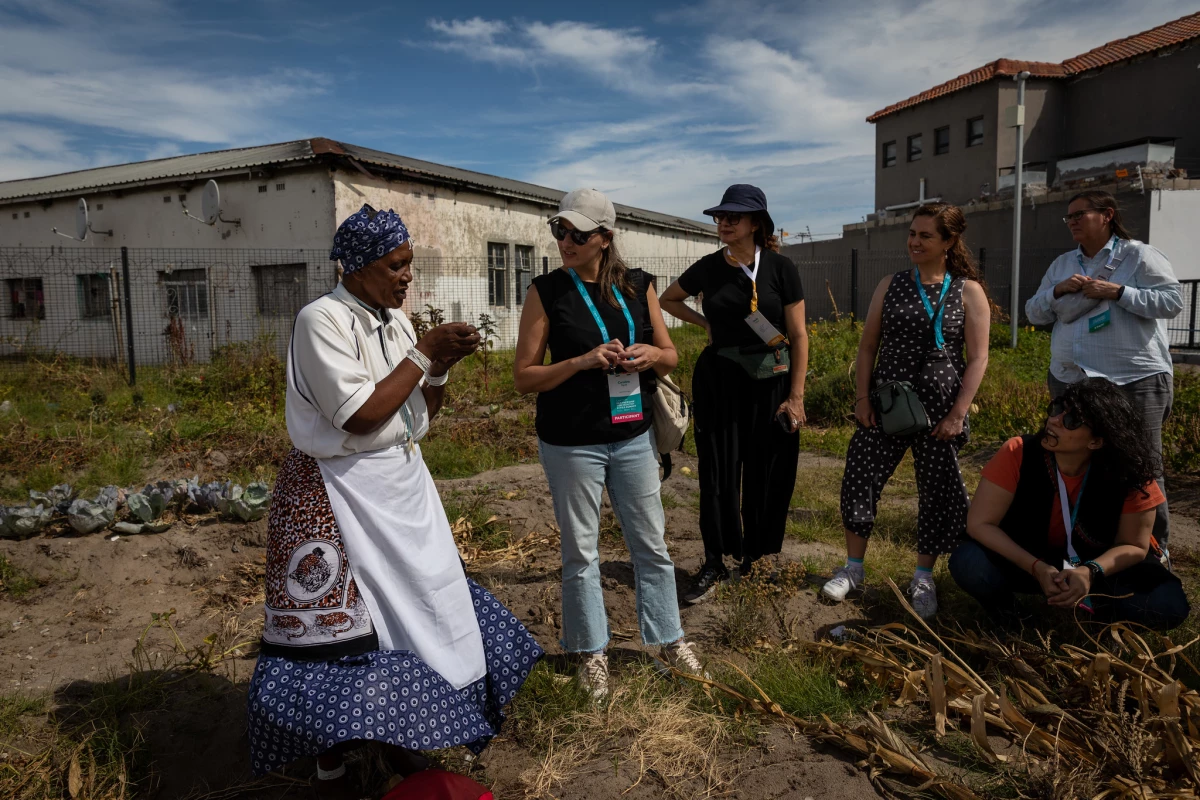 A resident from Cape Town's oldest township, Langa, explained a community garden initiative to participants at the Summit.